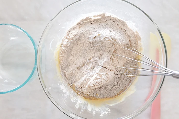 adding flours to wet ingredients