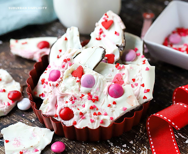 chocolate bark pieces in a red metal tray.