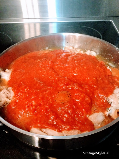 Chicken thighs in skillet while making sauce