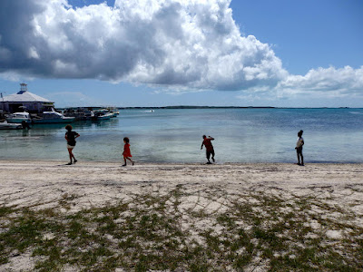 Children walking on the shore