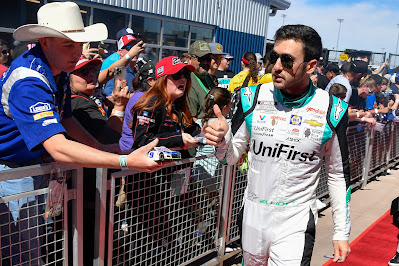 Chase Elliott, driver of the #9 UniFirst Chevrolet, gives a thumbs up to fans during the red carpet prior to the Ruoff Mortgage 500 during at Phoenix Raceway.