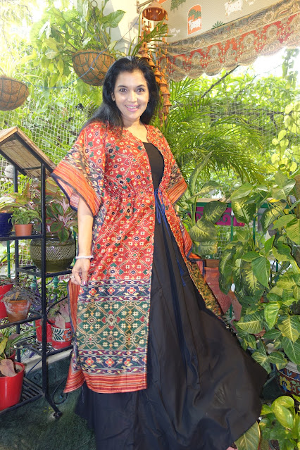 Digital print silk chanderi Patola cape. It comes with this black anarkali and can be paired on top of any outfit.