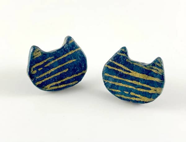teal and gold cat head-shaped paper mache earrings