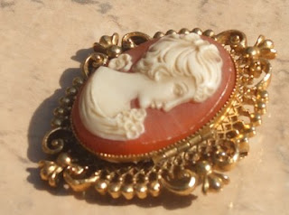 Avon cameo brooch with solid perfume 1970s