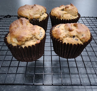 4 Almond Flour, Banana, Peanut Butter, Choc Chip Muffins on a cooling rack.