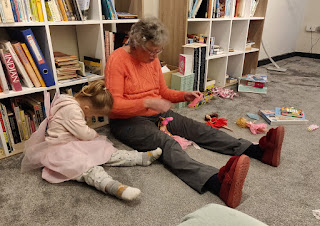 Playing with her toys with Grandma