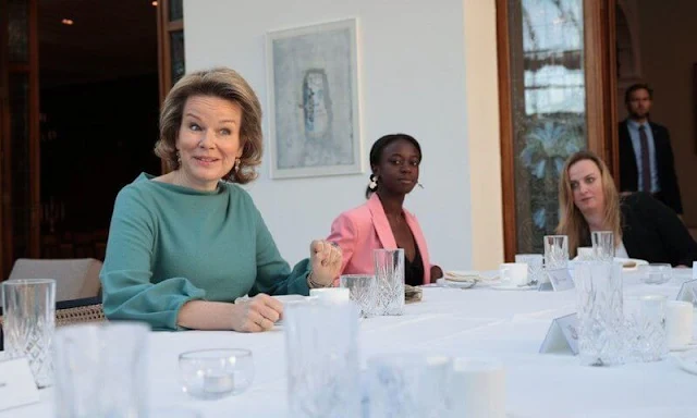 Queen Mathilde wore a blazer from Giorgio Armani Fall Winter 2019-20 collection, and a green belted midi dress from Natan