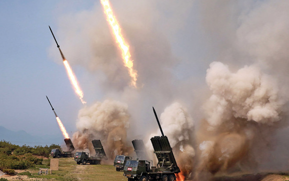 Rocket launchers firing during a test of weapons in an undisclosed location in North Korea. (AFP)