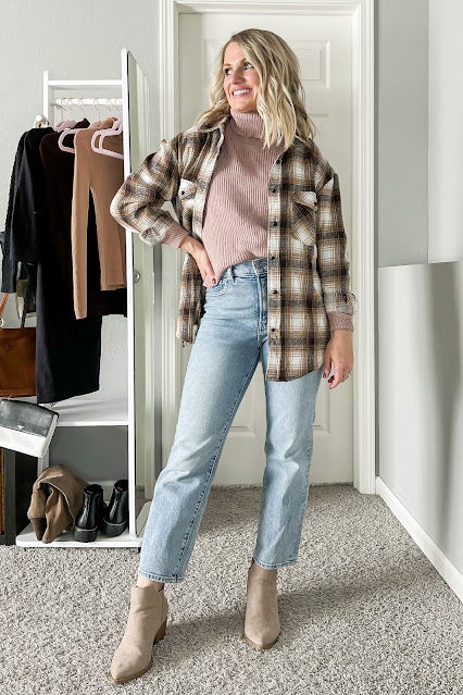 Styling a brown plaid shacket with a pink turtleneck sweater and jeans