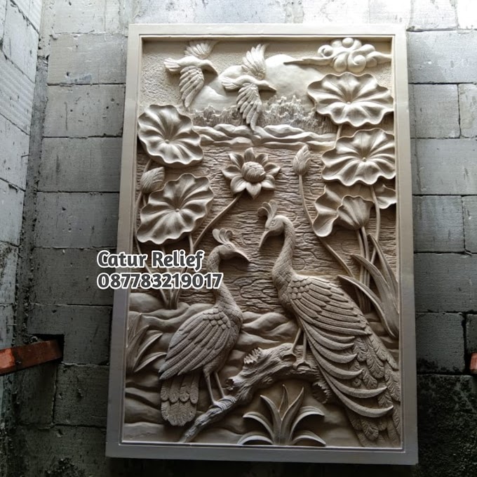 Relief batu ukir paras jogja motif burung merak