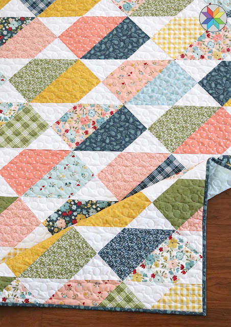 Crib sized Plot Twist quilt found on A Bright Corner quilt blog