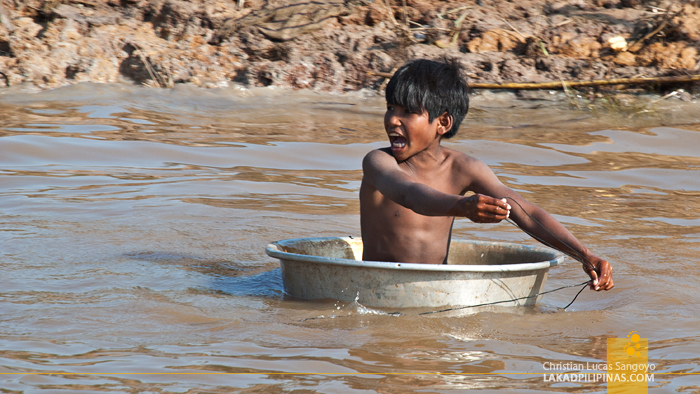 Kid Playing at the Floating Village of Kompong Phluk in Siem Reap