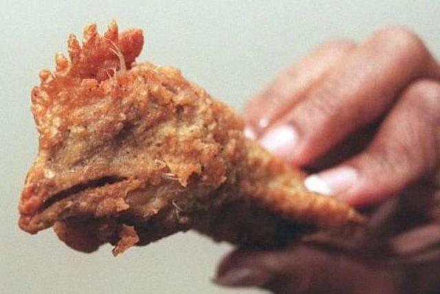 Woman Discovers Battered and Fried Chicken Head In Her Wicked Wings At KFC!