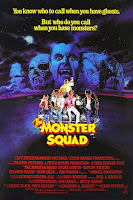 Monster Squad poster - young cast standing in front of a car with monster faces in the sky behind