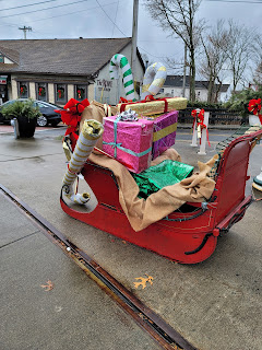 The red candy cane and gift boxes missing from the sleigh
