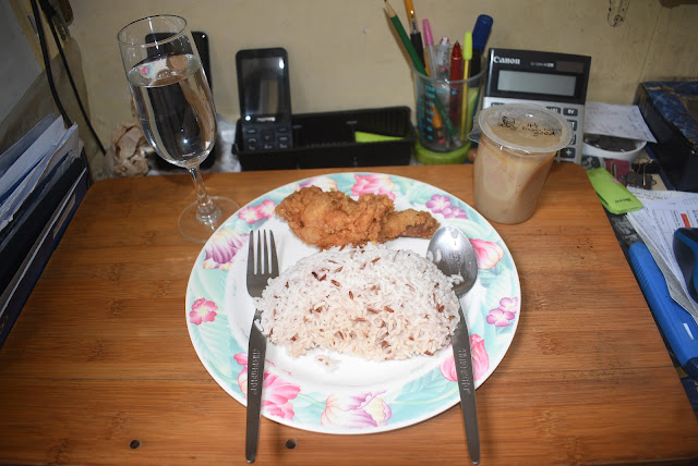 Plate with chicken and a wine glass