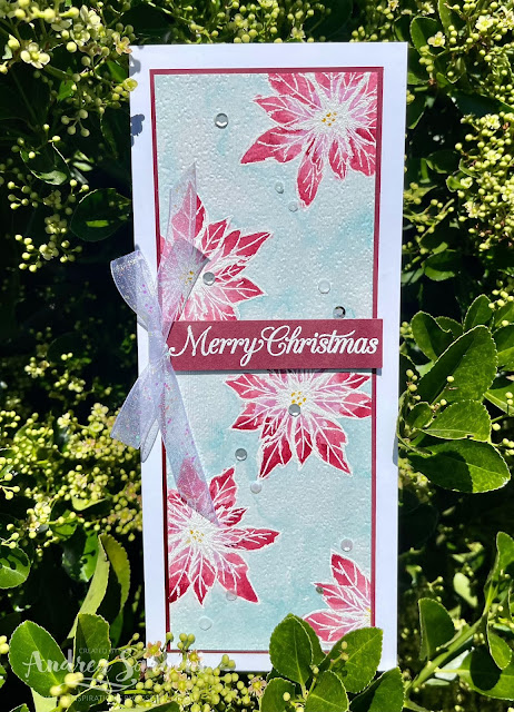Send Merry Christmas wishes with this water-coloured poinsettia slim line card by Andrea Sargent, Australia