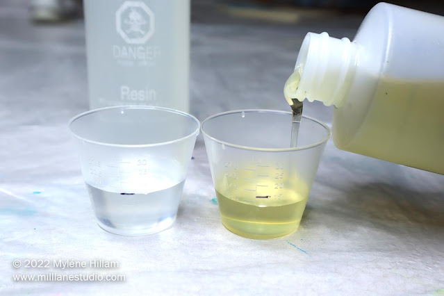 Place a mark on each measuring cup for the amount of resin and hardener that you need.