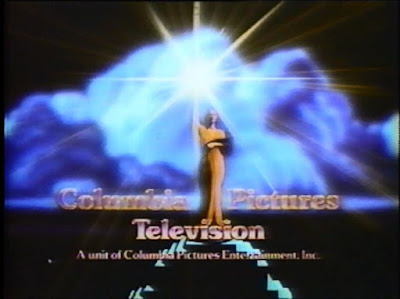 A woman holding a torch, dressed in an orange toga. Blue clouds aooear behind her. Columbia Pictures Television. A unit of Columbia Pictures Industries Inc.