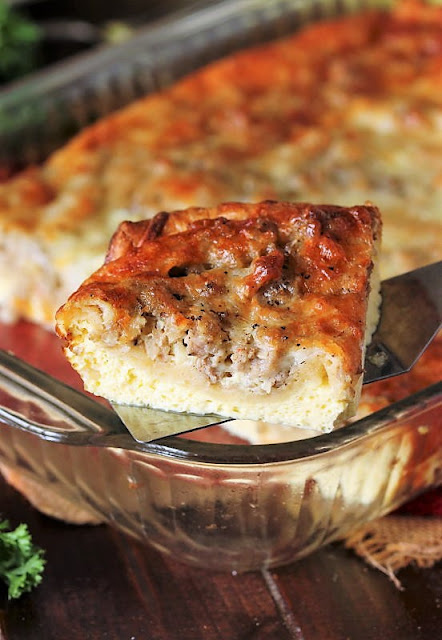 Serving a Slice of Crescent Sausage and Egg Casserole Image