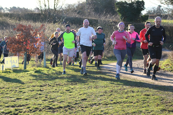 Ian running with other athletes at the start of the event