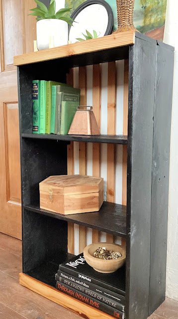 style a bookshelf with thrift store finds