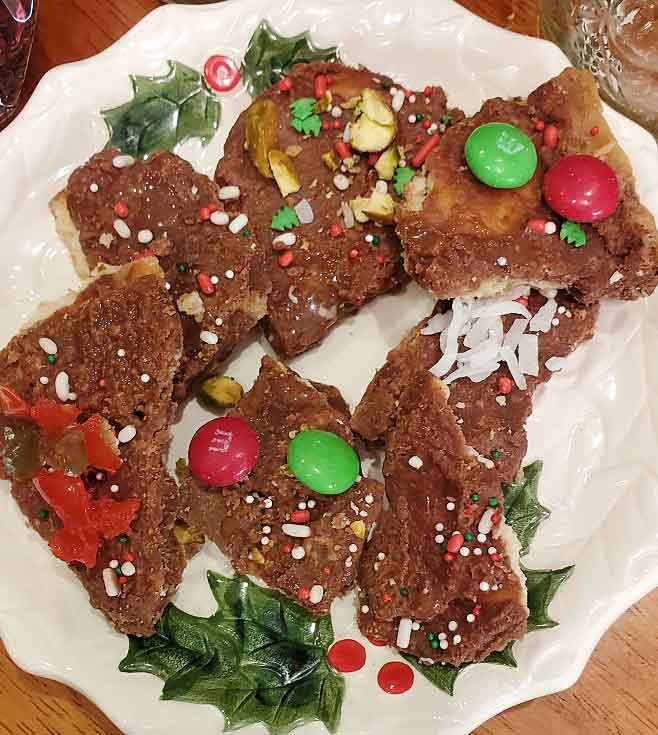 this is a toffee candy made with crackers decorated in Holiday colors