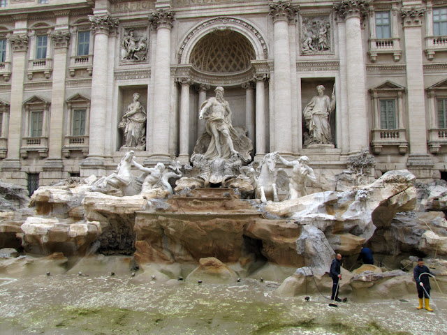 At work cleaning the dry Trevi fountain, Rome