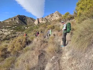 Hikers on a path in the mountains