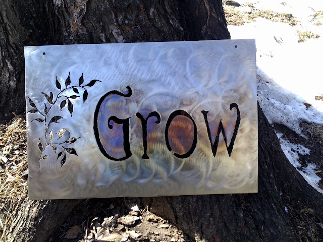 metal sign: Grow, The Camellia