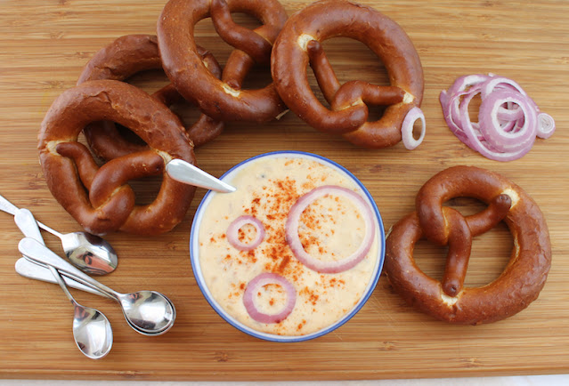 Food Lust People Love: Bavarian Cheese Spread, also known as obatzter, obazda, obazde, obazd'n and obatzda, is a strong cheese spread made with ripe Camembert, cream cheese, butter, onions, spices and, of course, beer. It’s a classic Bavarian beer garden recipe, best enjoyed with a cold stein of Weissbier or indeed, your own favorite brew.