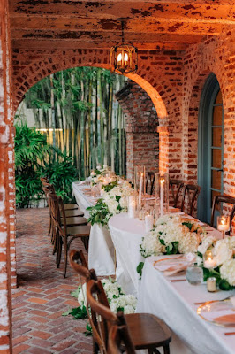 casa feliz wedding reception tables with flowers and white linen