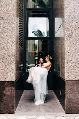 groom holding bride