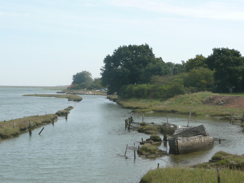 neglected boats sit in Landmere Quay