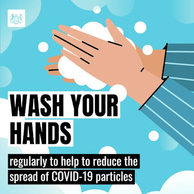 Wash your hands regularly image of hands and soap bubbles