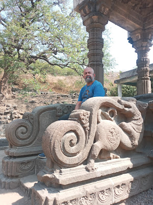 Sitting on the steps leading to "Yajaneshwar Temple".