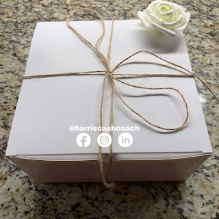 Gift box with brown string and white rose