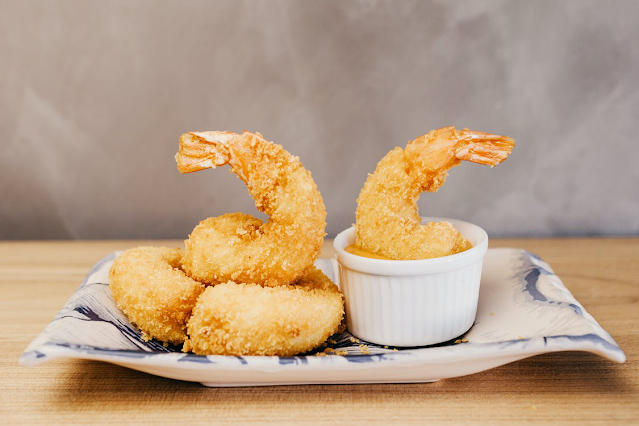 Shrimp on a plate with dipping sauce