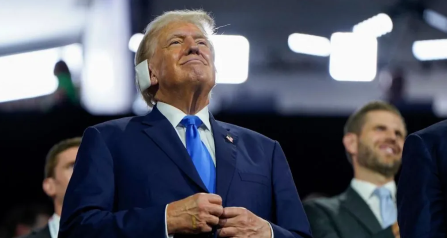 Donald Trump smiled at times as he watched his ex-rivals back his campaign