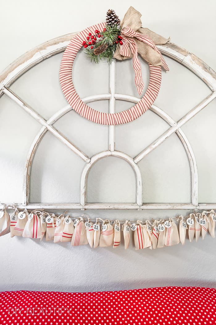 antique arch window with ticking stripe wreath and faux grain sack advent calendar