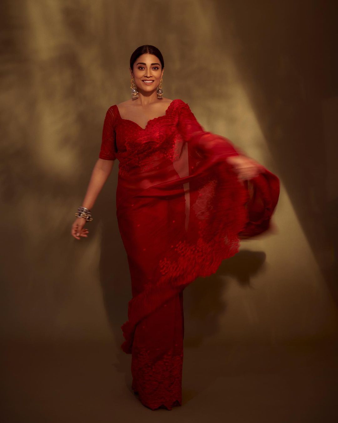 The Dishryam 2 actress Shriya Saran exudes elegance in a red saree