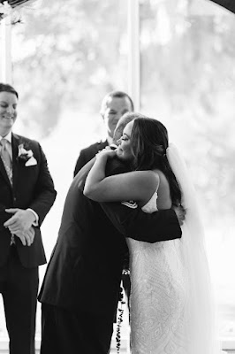 bride hugging dad at altar