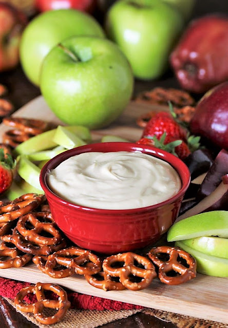 Bowl of Creamy Caramel Dip with Pretzels and Apple Slices Image