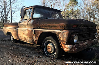 Truck was originally blue with white roof and spear, now rust is only color.
