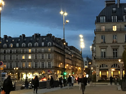 light up street view in the evening of the first arrondissement in Paris