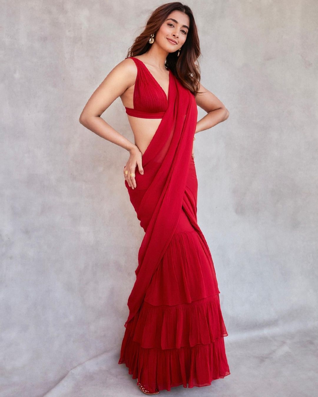 Bollywood Actress Pooja Hegde dazzles in a red ruffle saree worth ₹55k