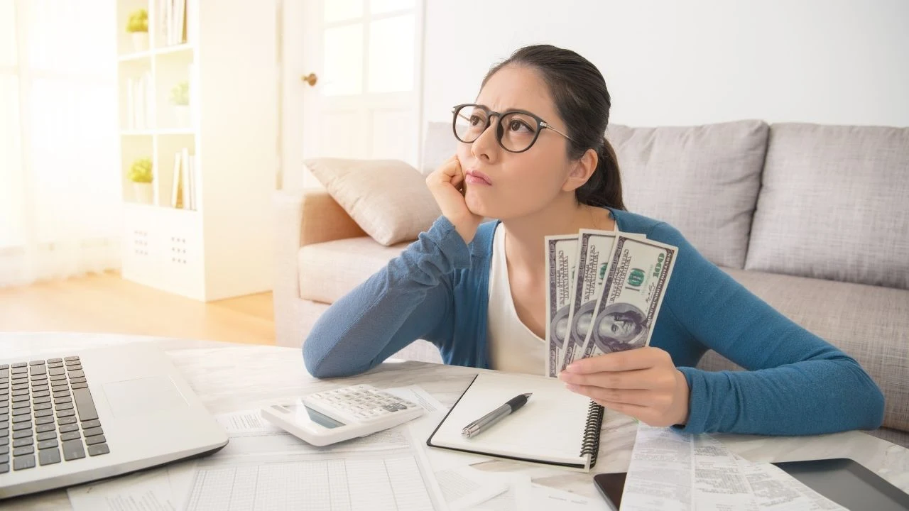 Woman worried about expenses at home.