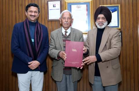 Shoolini University Vice Chancellor Dr PK Khosla, (Right) with Mr. Vivek Atray presenting the letter to Col.D.S. Cheema