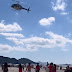 Helicóptero faz chover dinheiro em praia do Sul do Brasil