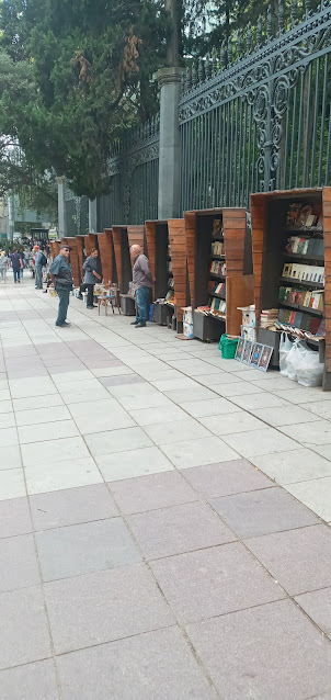 Second hand book shops on footpath at  Liberty (Freedom)Square.